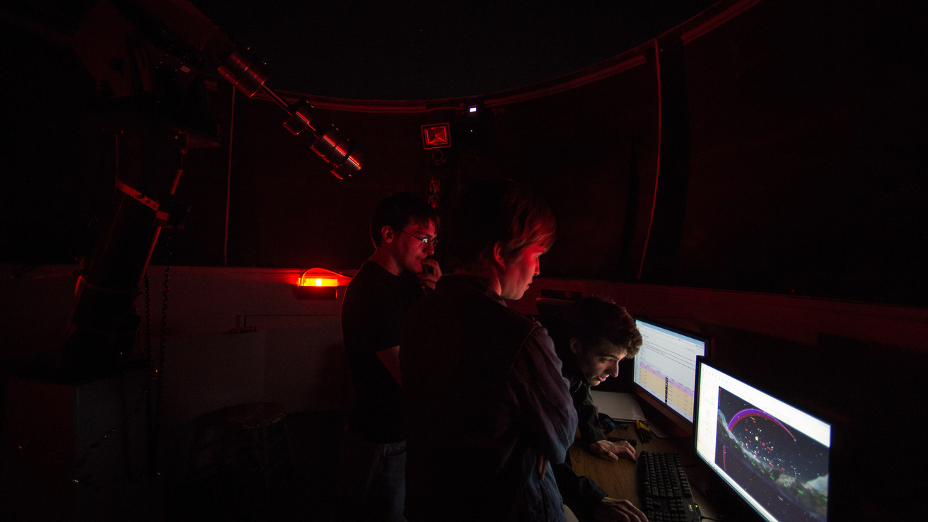 Students examine the Van Allen Observatory control computer screen.